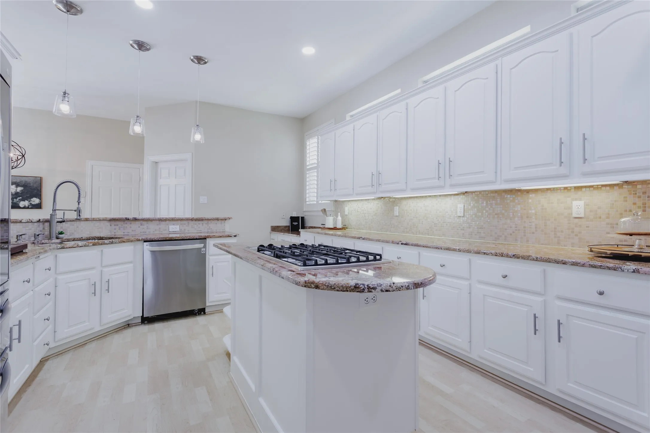 White Kitchen with Granite Counters, Island Cooking and Updated Appliances, Hardware and Fixtures!