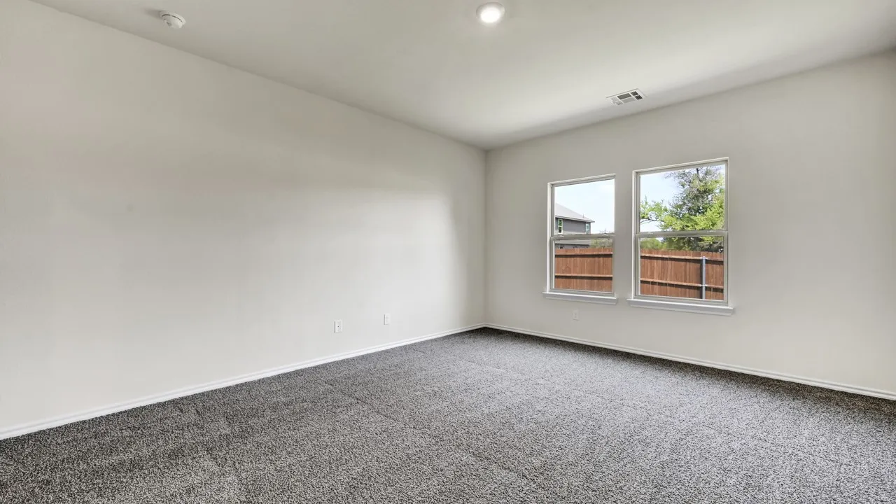 Neutral wall paint, recessed lighting, and carpeted flooring