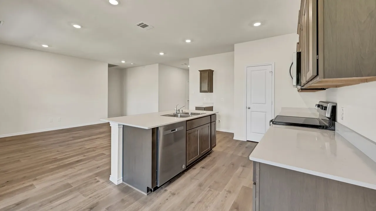 Kitchen island with stainless steel dishwasher and undermount sink