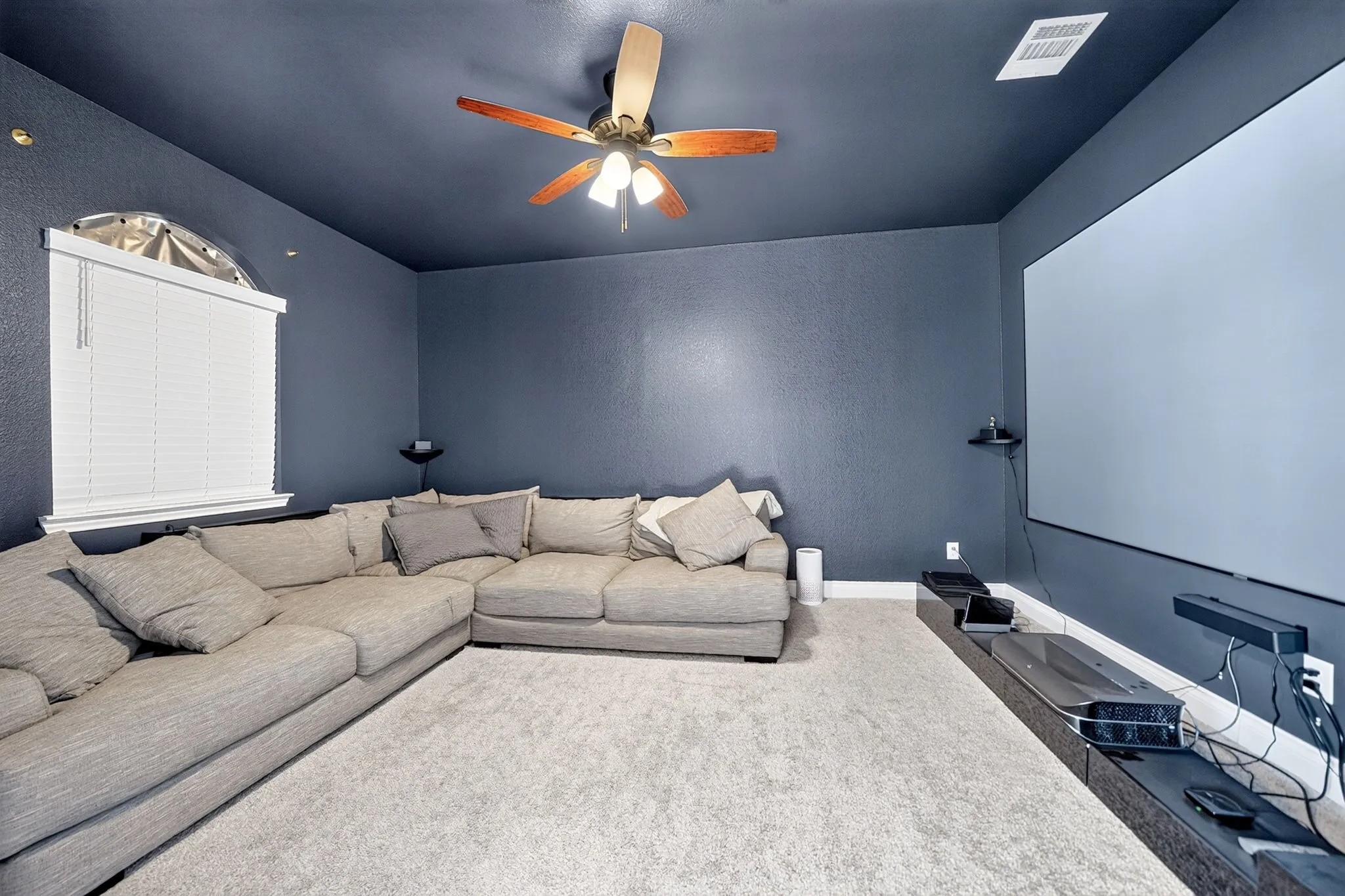 Room featuring a ceiling fan, window with blinds, and recessed lighting