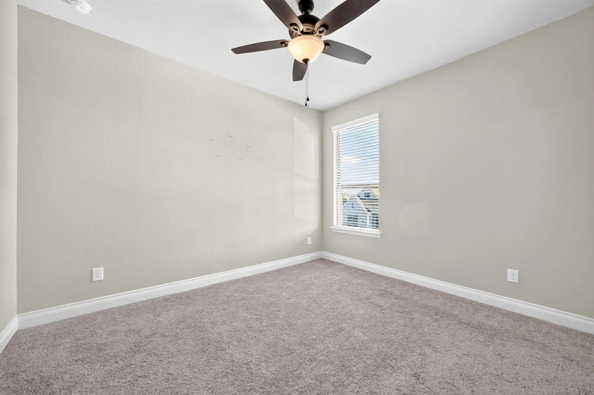 Recessed lighting, ceiling fan with integrated light, wall-to-wall carpeting, and window with blinds