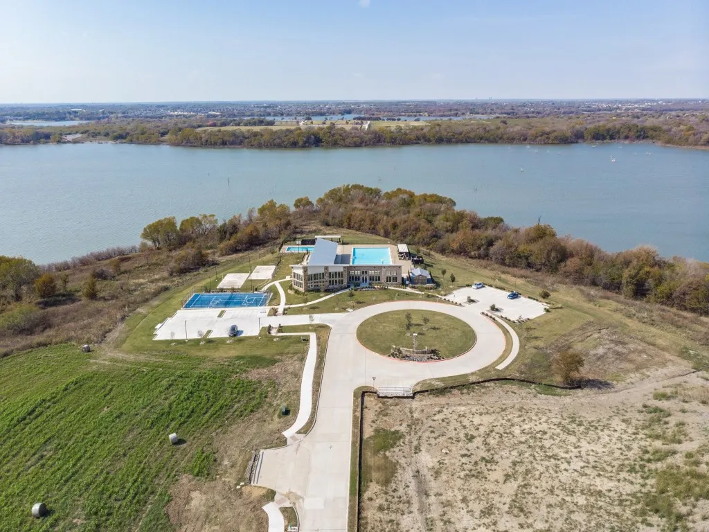 Waterfront property with extensive water frontage, a large swimming pool, two tennis courts