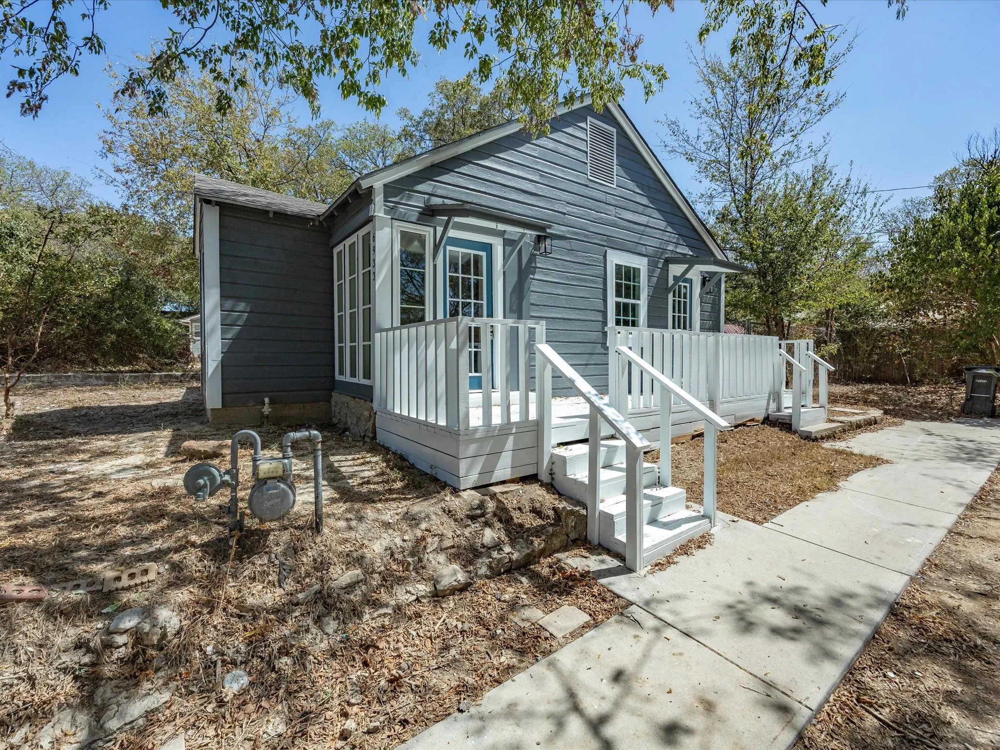 Blue siding exterior with white trim