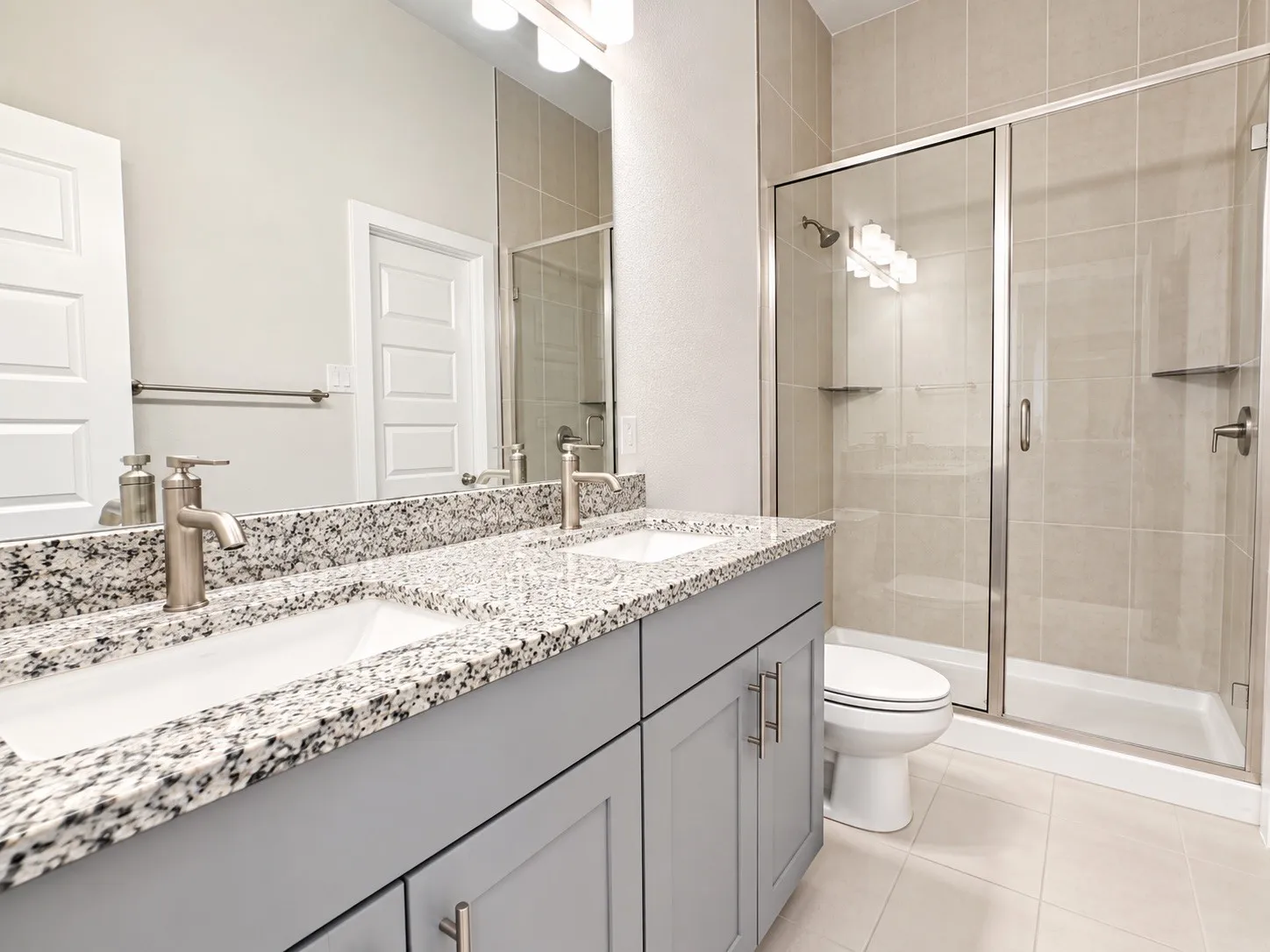 Dual vanity with granite countertop and undermount sinks