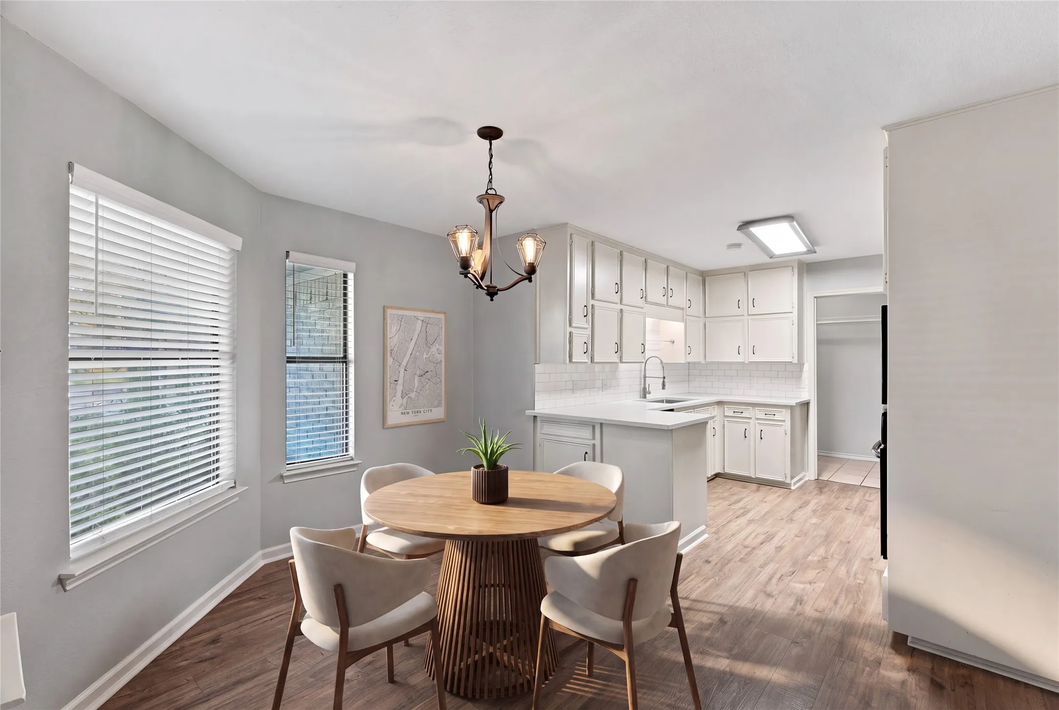 Decorative lighting, two windows with blinds (Virtually staged)