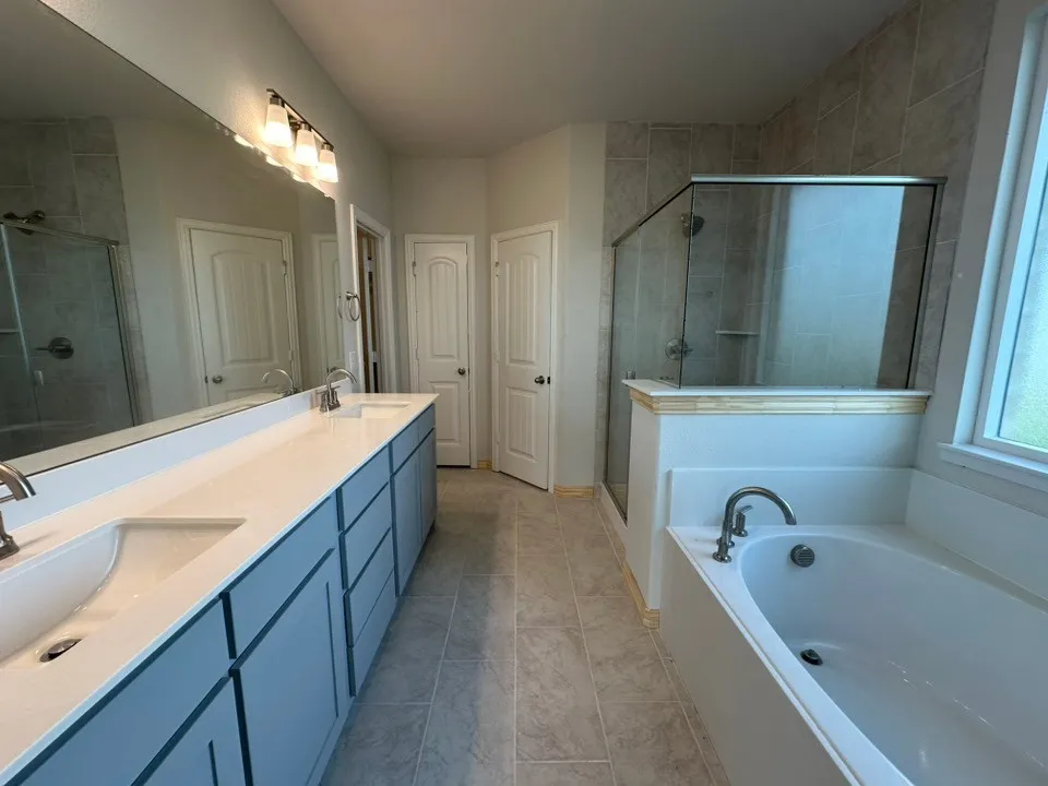 Double vanity with undermount sinks and light blue cabinetry