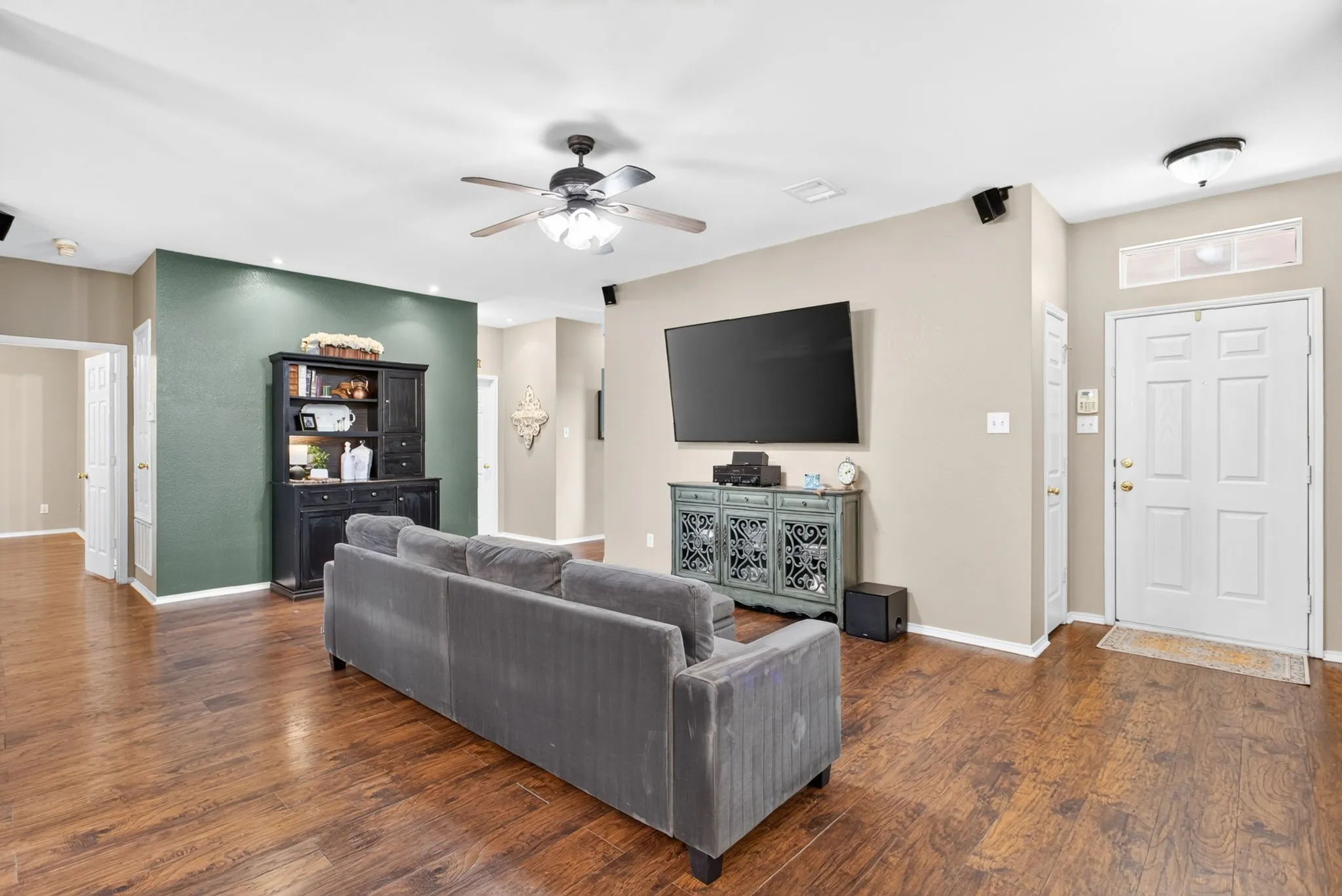 Wood-finish flooring throughout, ceiling fan with light fixture, recessed lighting