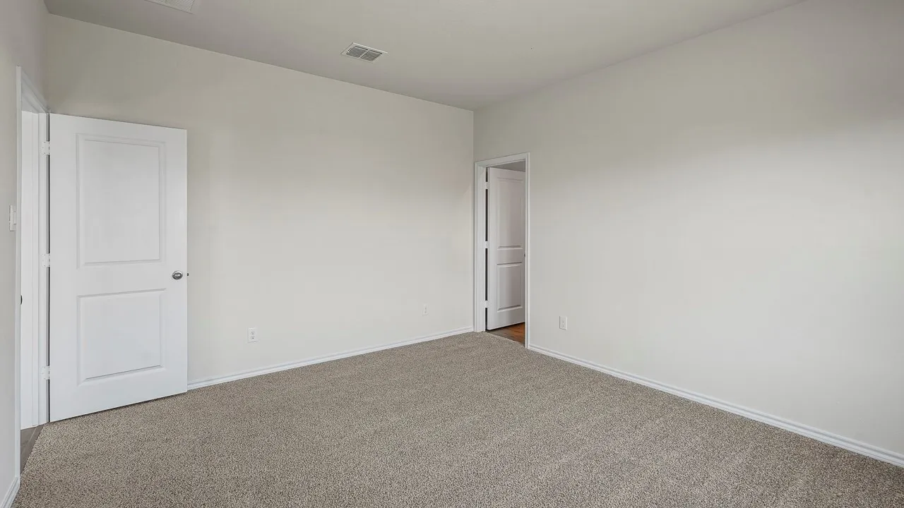 Light gray carpet flooring, white walls, and white trim
