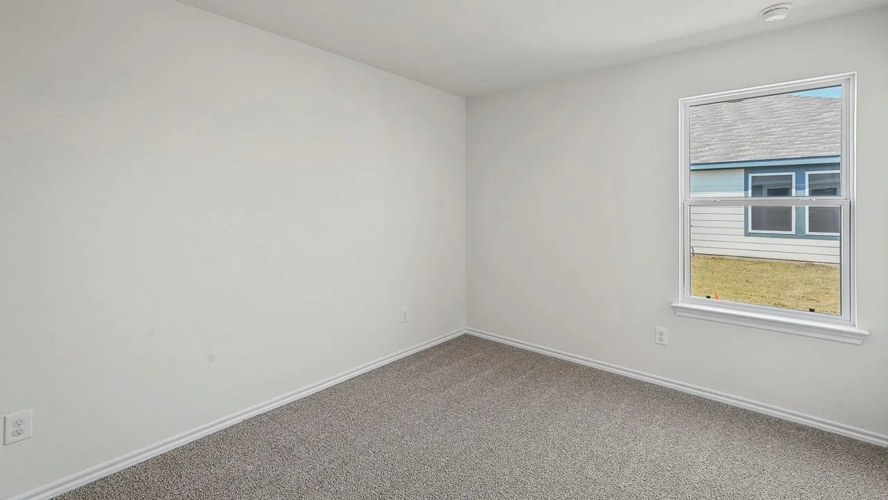 Room featuring neutral wall paint, gray carpet, a single-pane window, and white trim