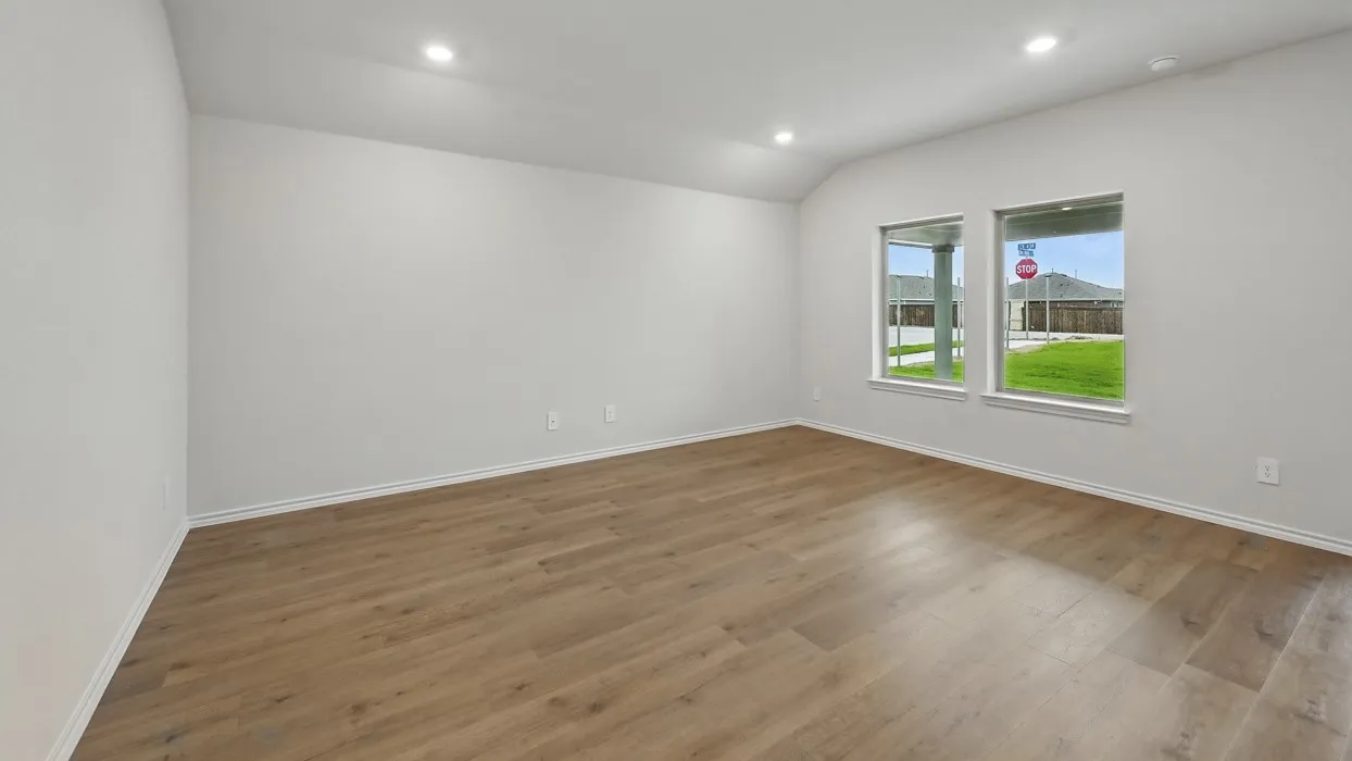Recessed lighting, wood-finish flooring, and white painted walls