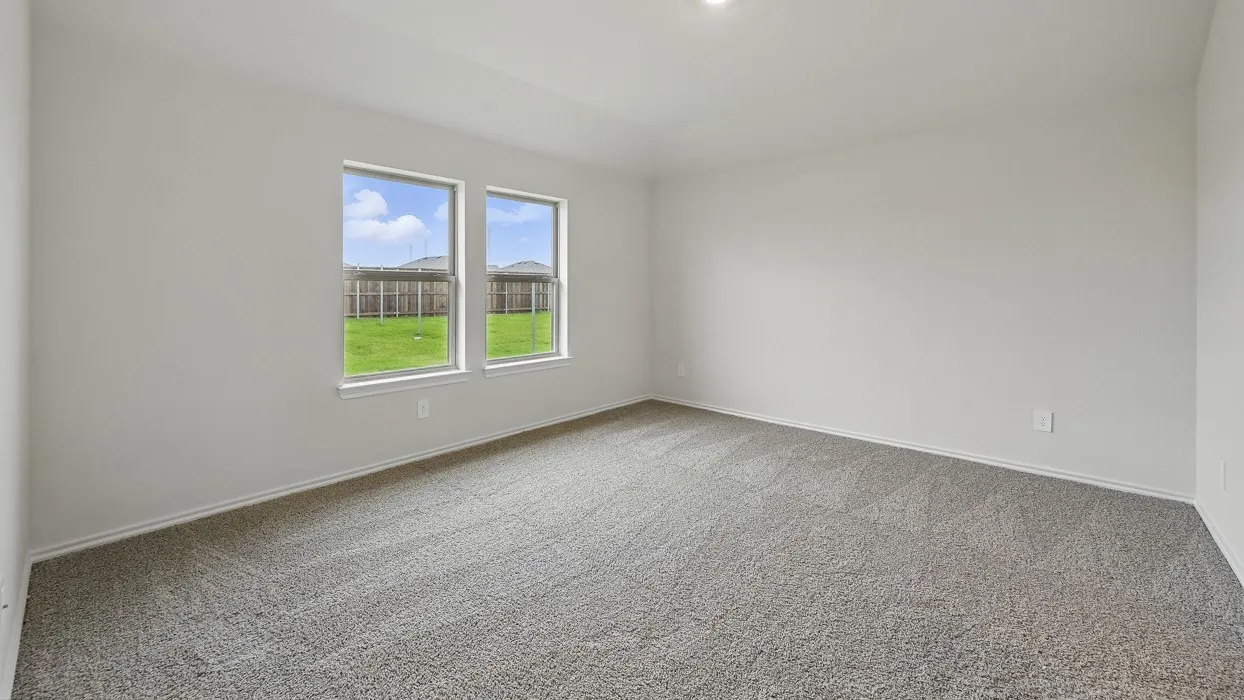 Light gray carpeting throughout, dual windows providing natural light, and recessed ceiling lighting