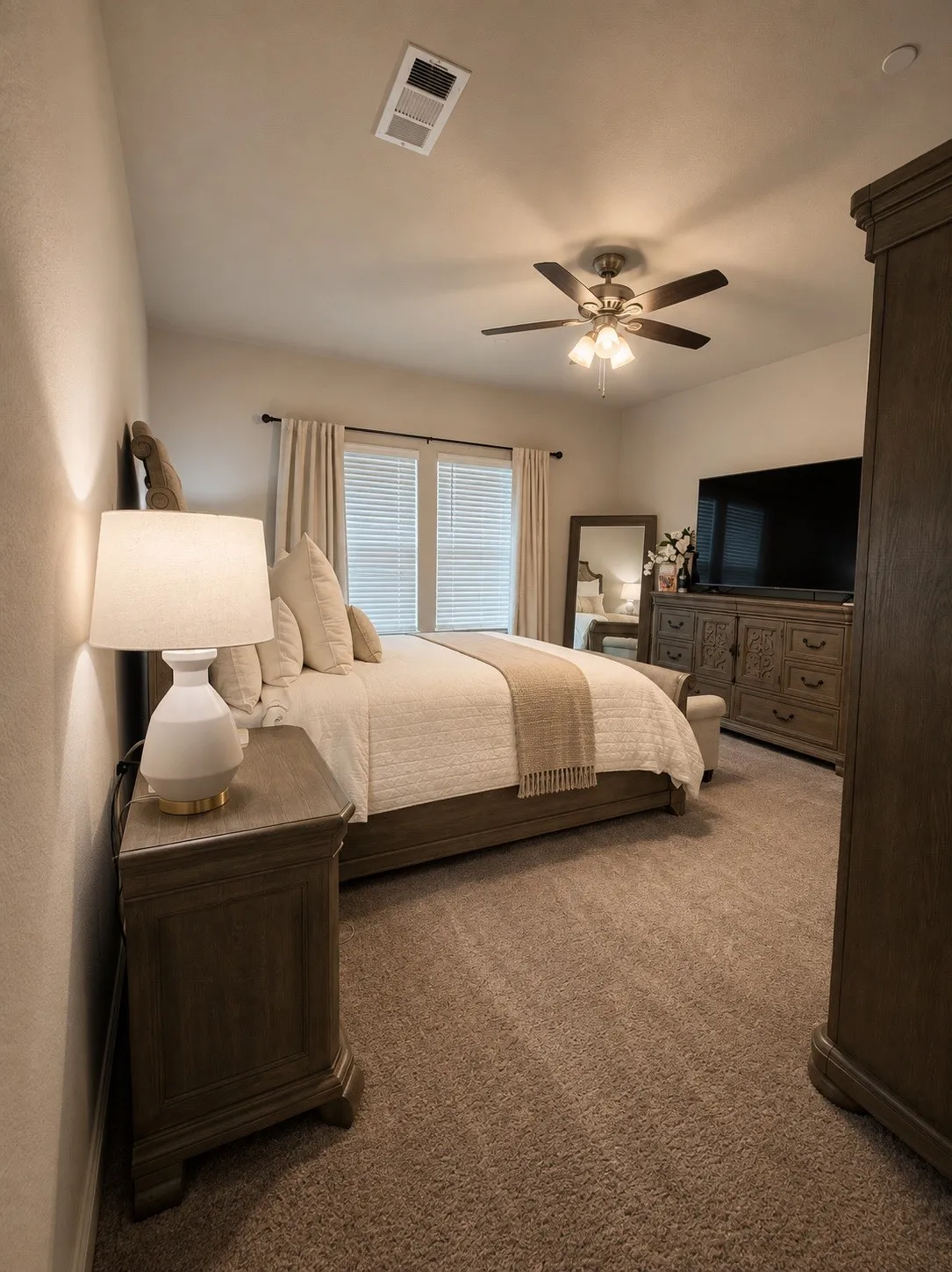 Carpeted flooring, ceiling fan with integrated lighting, and windows with horizontal blinds