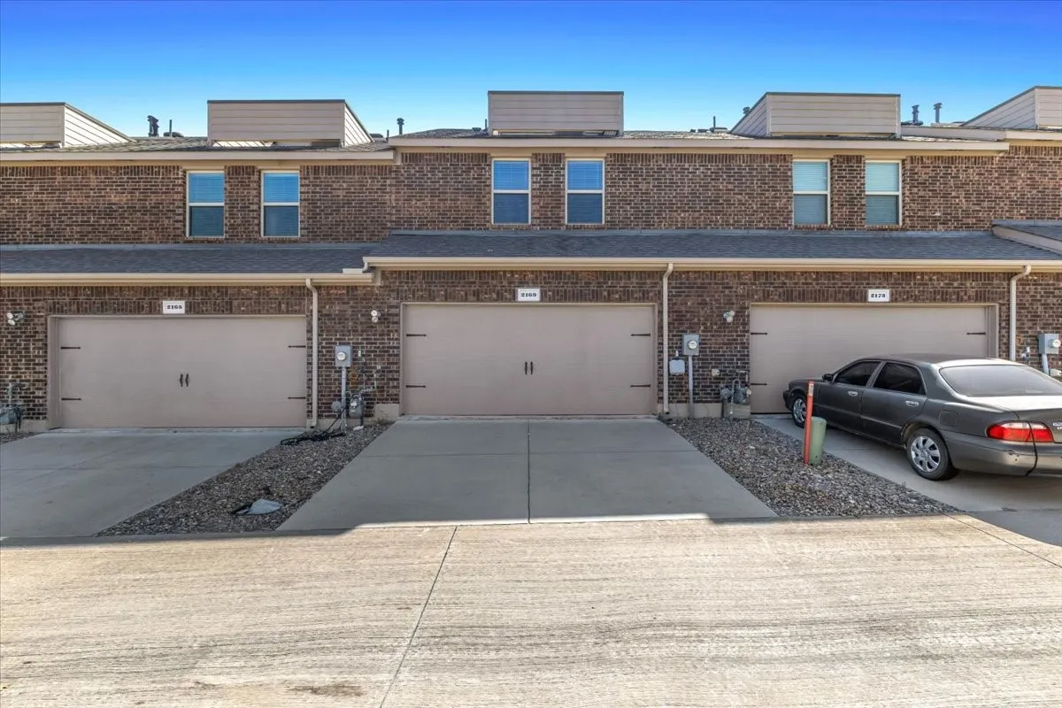 Brick exterior construction with multiple garage doors
