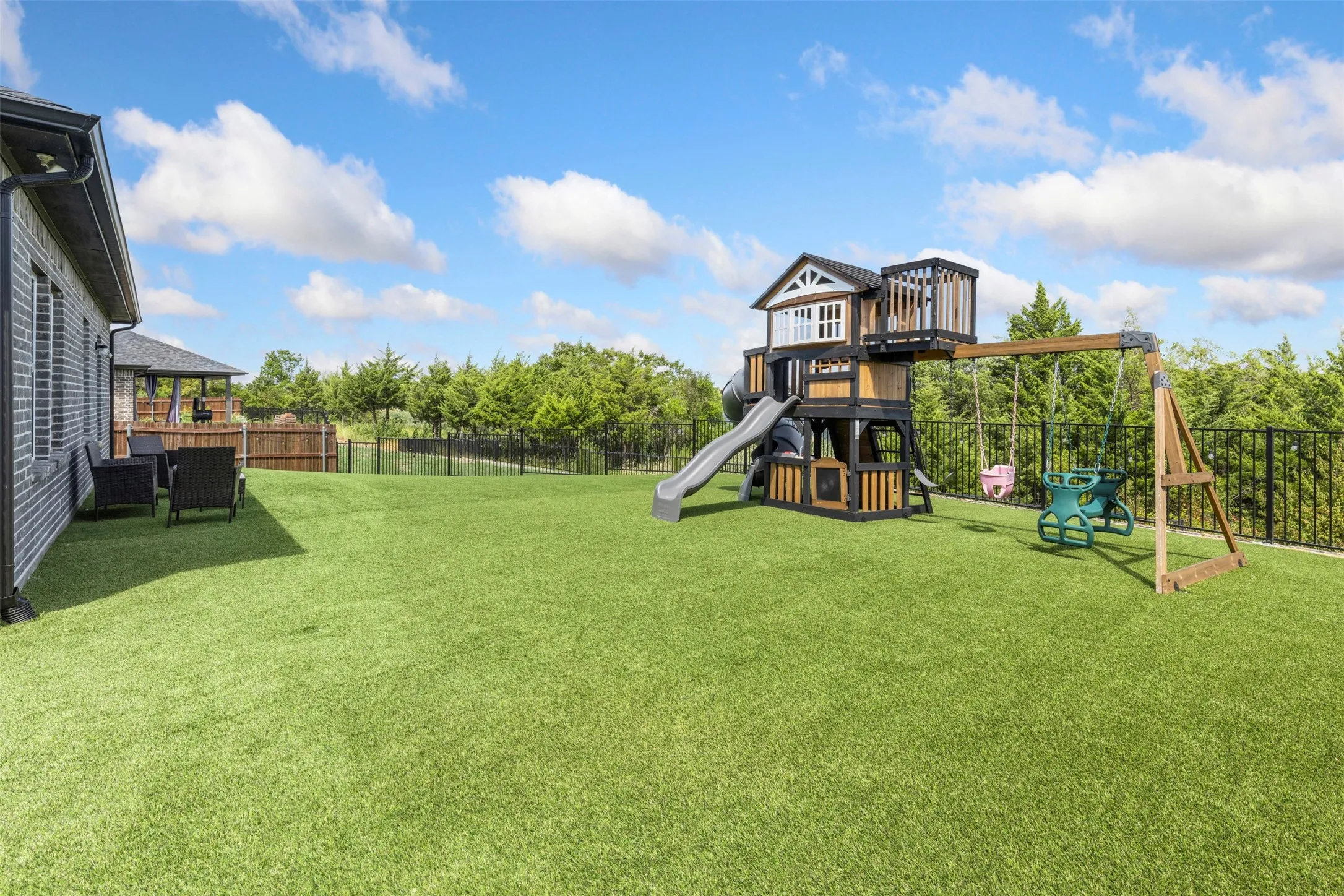 Turfed Backyard with Putting Green