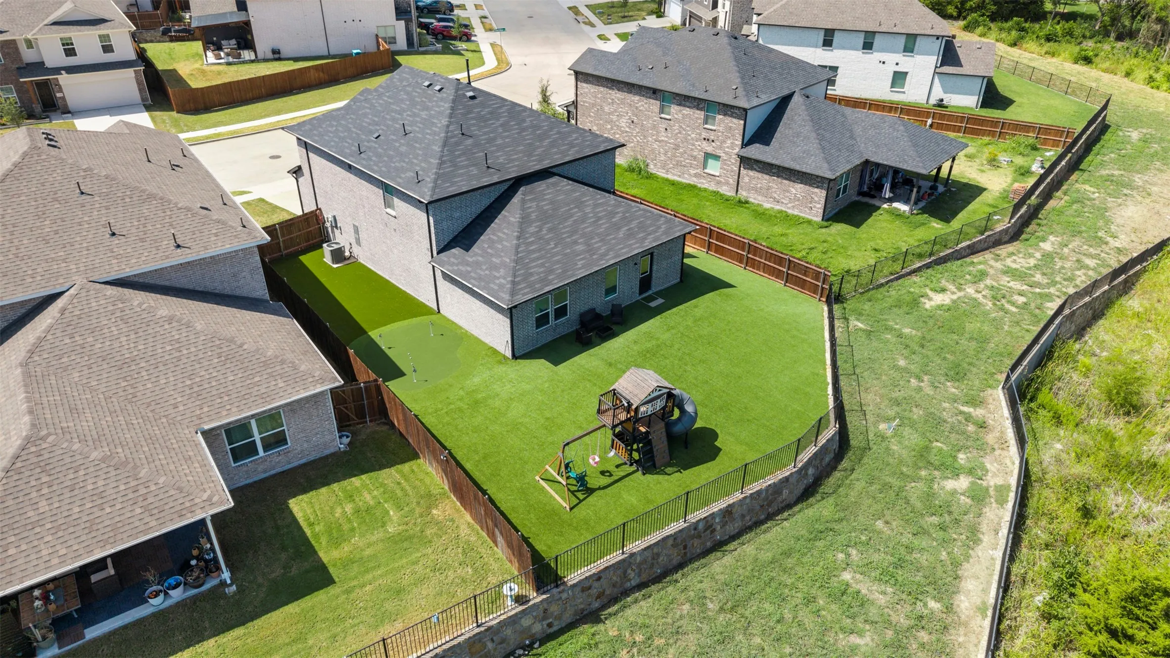 Backyard has over 3181 SF in Turf with Playlet