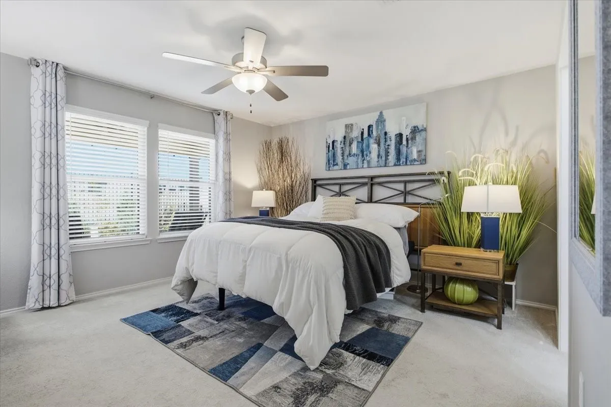 The primary bedroom looks out onto your beautifully landscaped backyard.