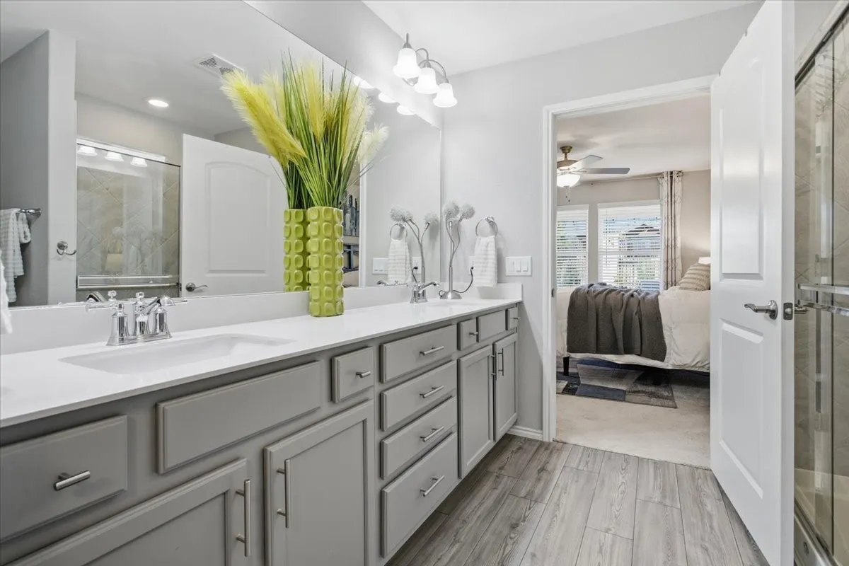 The primary bath has double sinks and a large walk in shower.