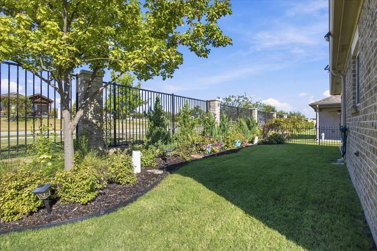 This lot has beautiful landscaping and backs up to a walking path and quiet street