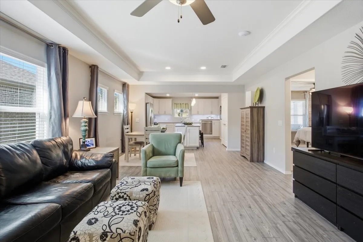 The living room is spacious and is open to the dining area and kitchen.