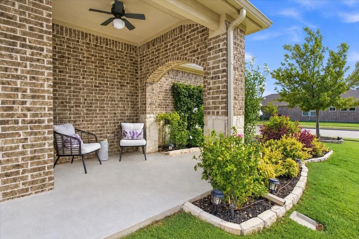 The front porch with ceiling fan is the perfect spot for your morning coffee!