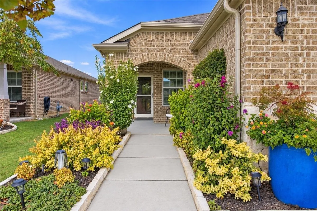 Your walkway has gorgeous landscaping!