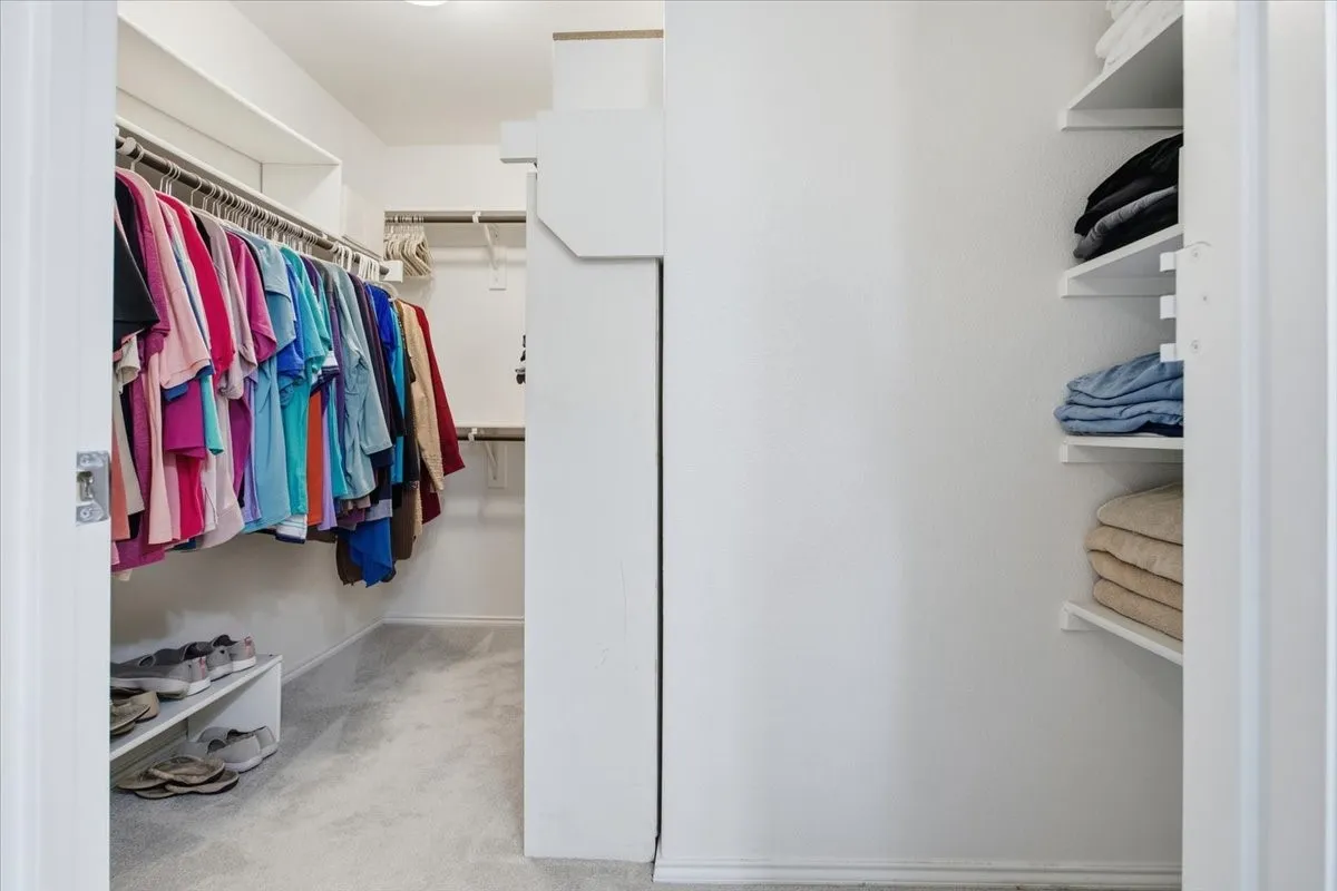 The primary closet is a nice size and has built in storage shelves.