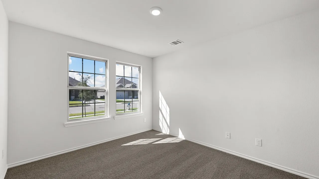 Room featuring two large grid-pattern windows, recessed lighting, wall-to-wall carpeting, and white baseboards