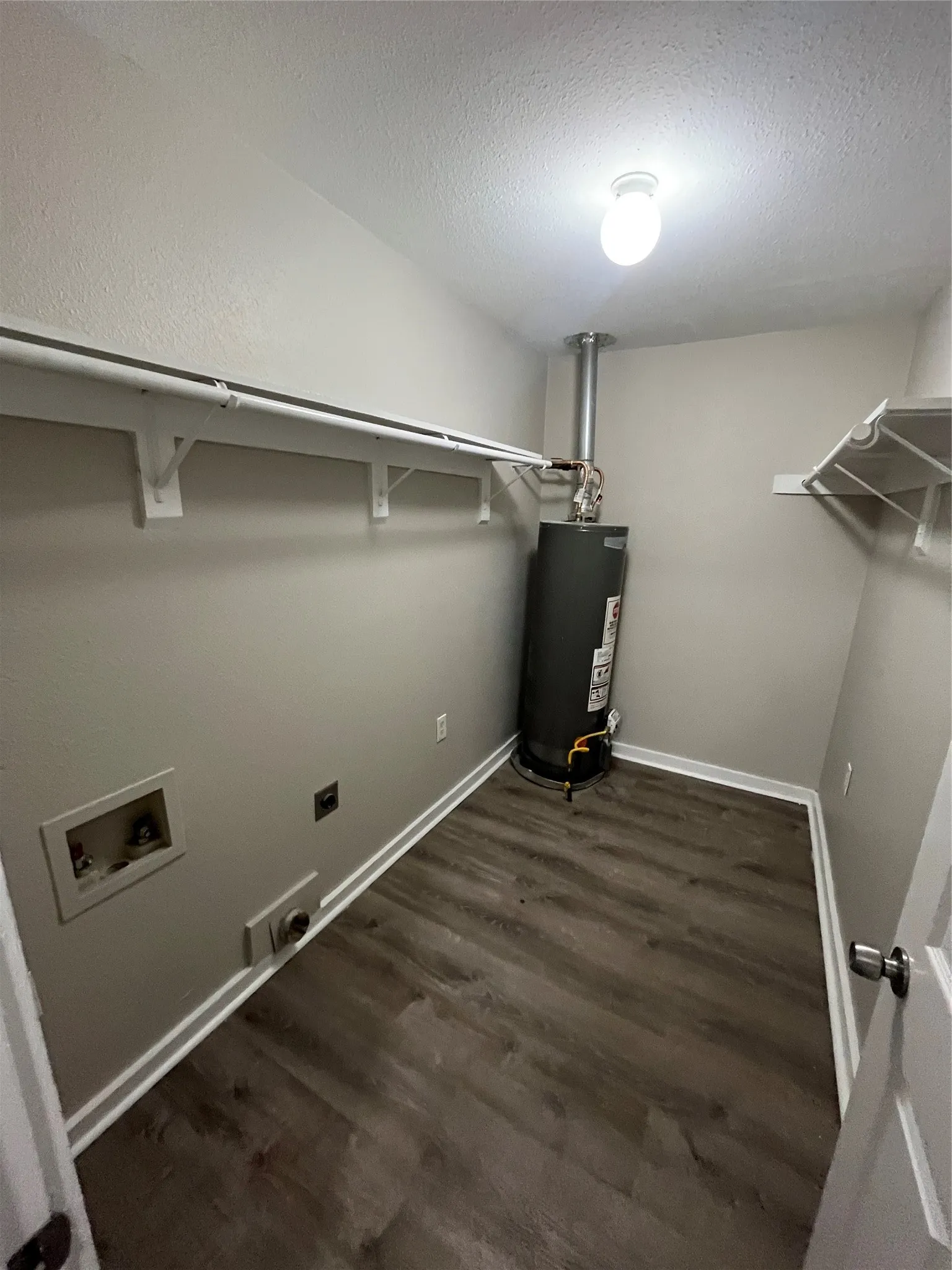 Wood-finish flooring with white baseboards