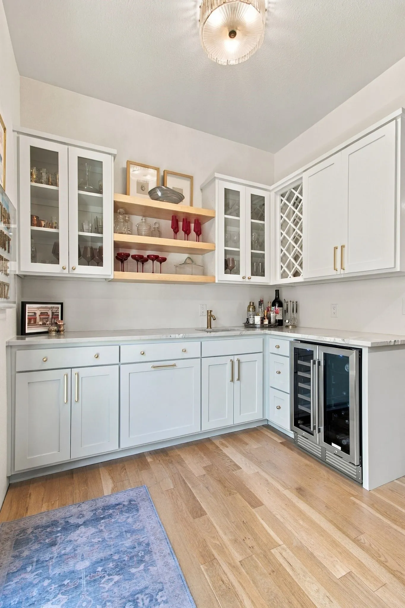 Light wood-finish flooring with a built-in beverage refrigerator