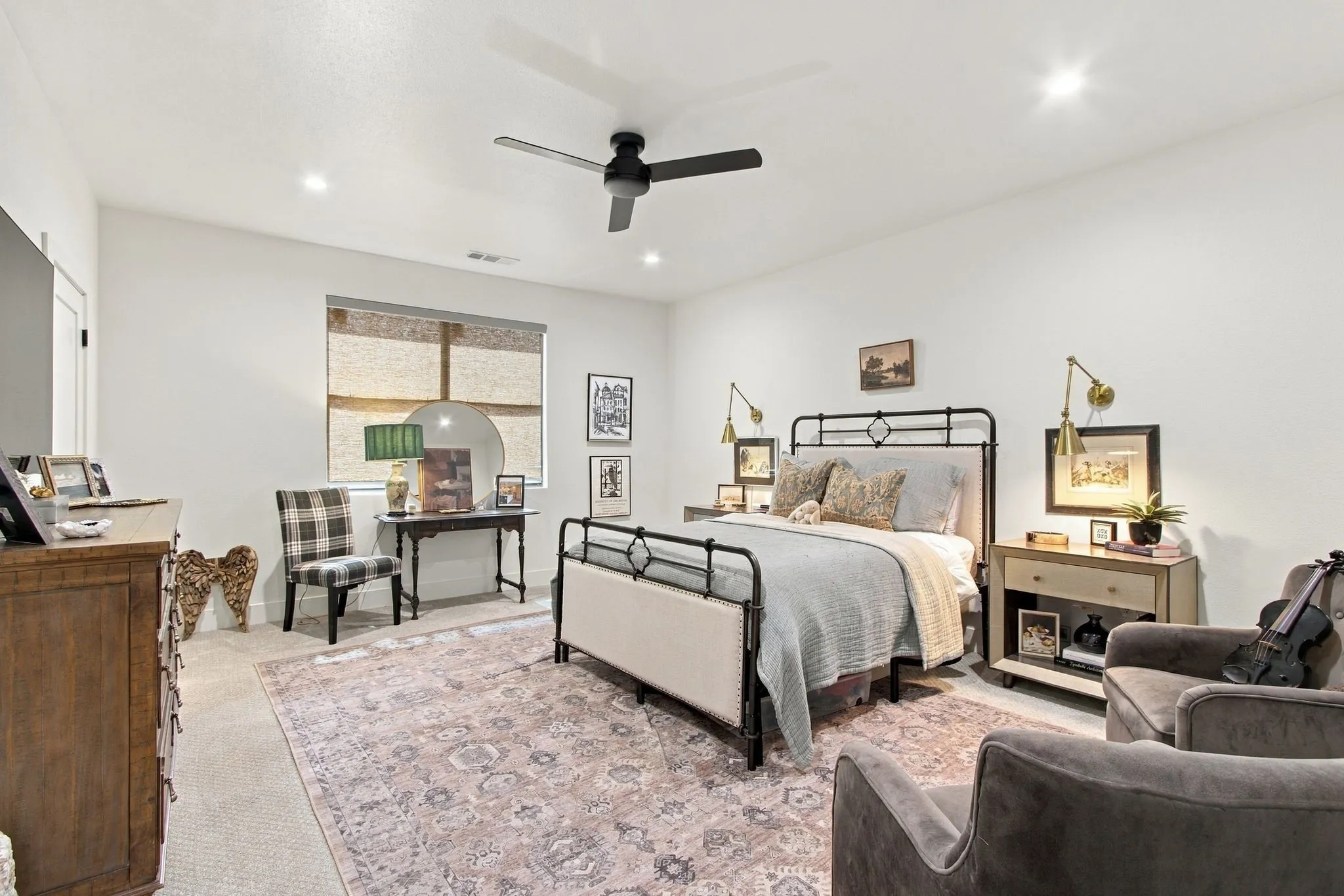 Recessed lighting, ceiling fan, and window with roller shade