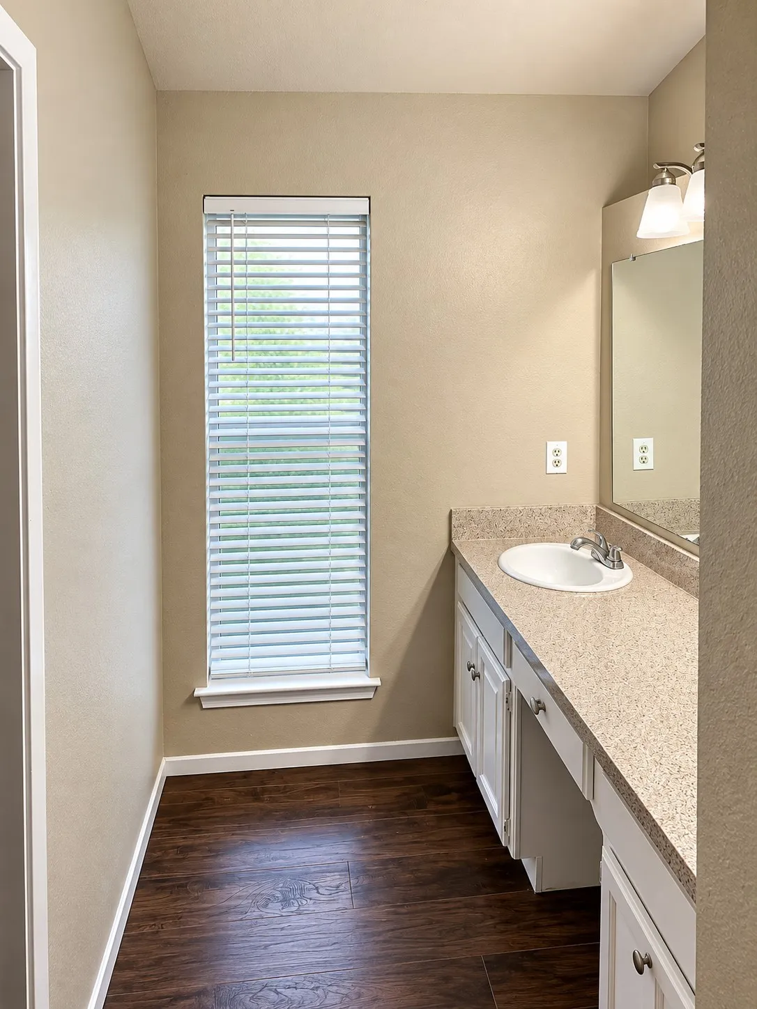 201- Vanity with an integrated sink, polished chrome faucet, and ample countertop space