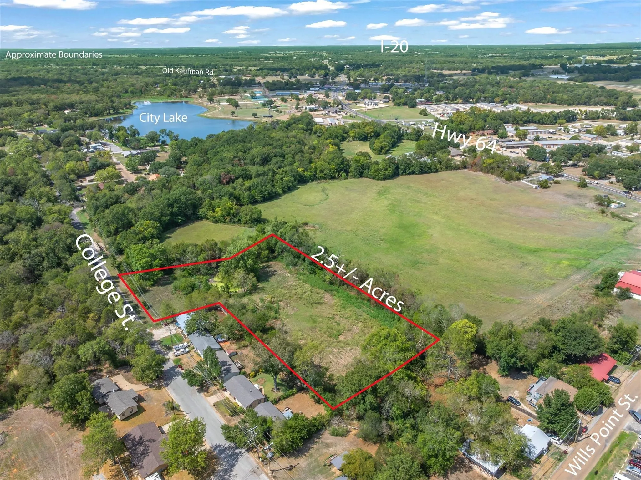 2.5 acres with pond close to town, the city lake and all conveniences.