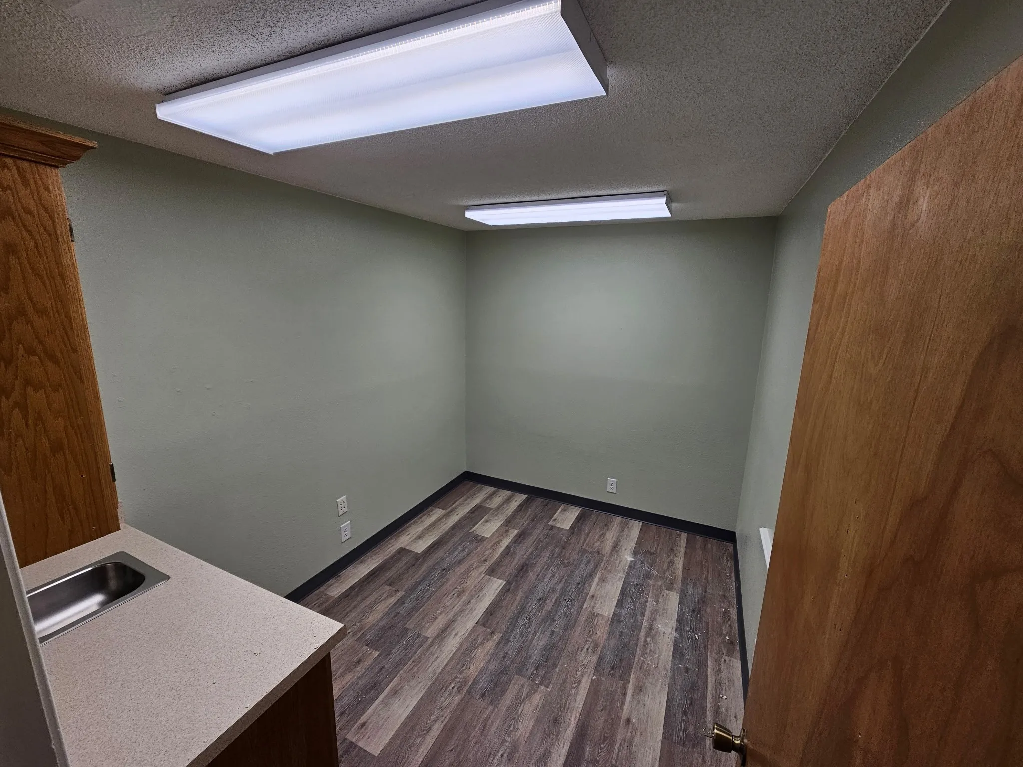Exam Room #1 with cabinets and sink
