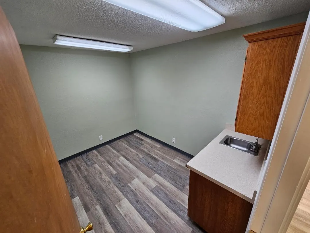 Exam Room #5 with sink and cabinets