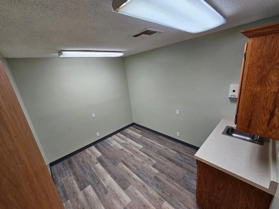 Exam Room #3 with sink and cabinets