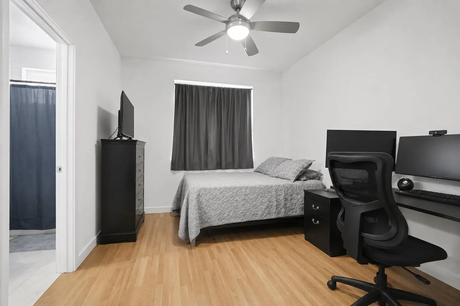 Recessed lighting, wood-finish flooring, and a ceiling fan with integrated lighting