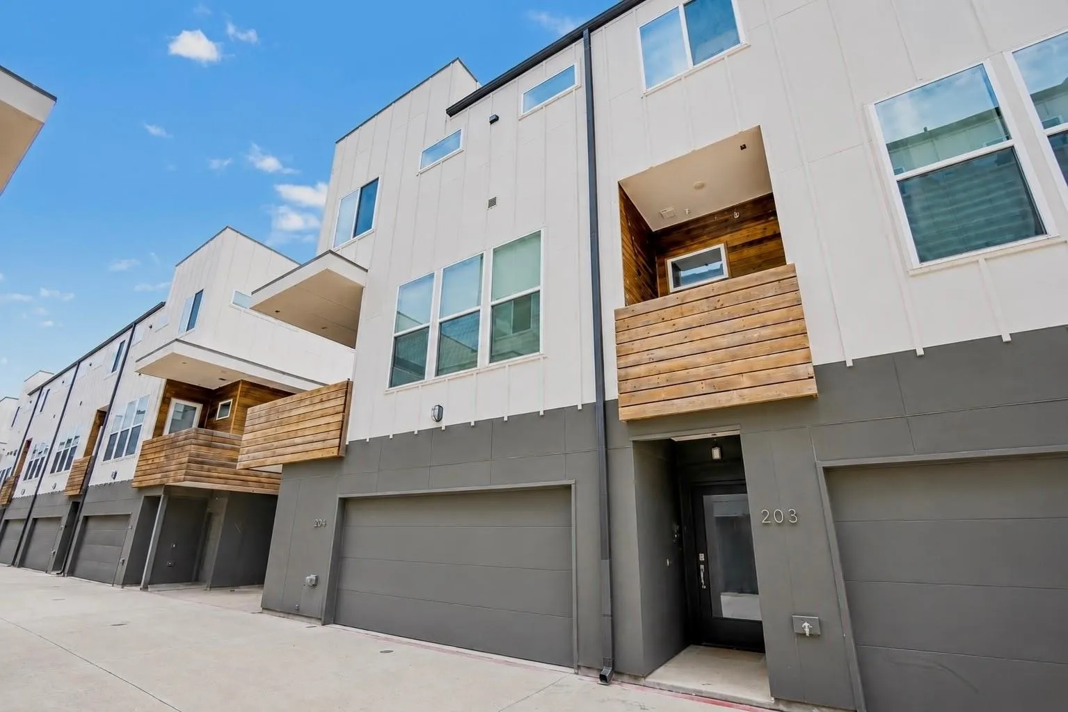 Modern exterior design with horizontal wood-look siding accents