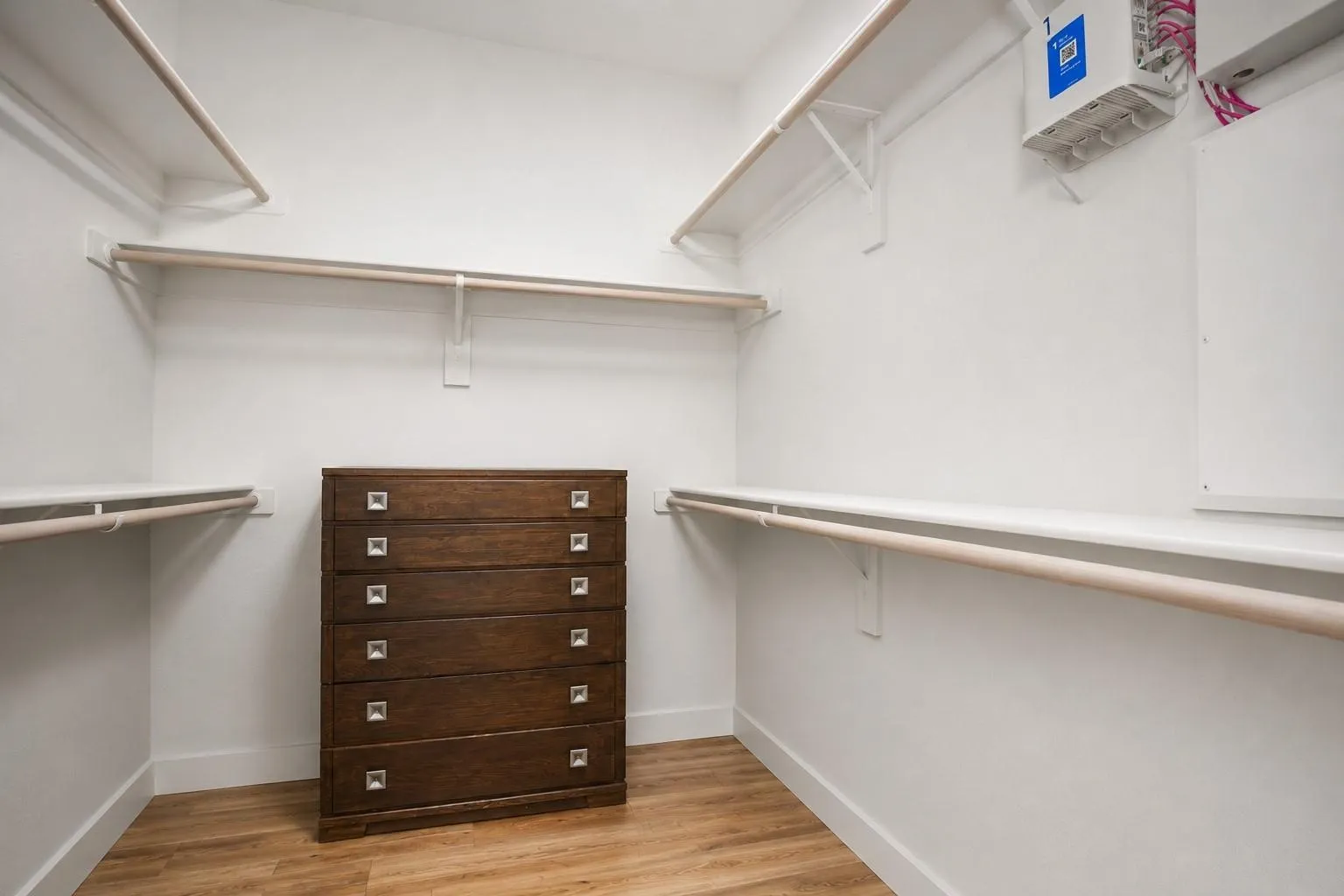 White walls with wood-finish flooring