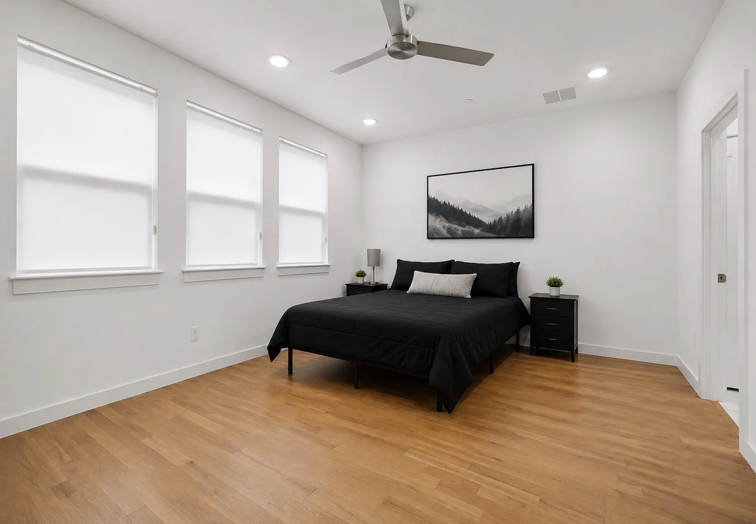 Wood-finish flooring, recessed lighting, and a contemporary ceiling fan