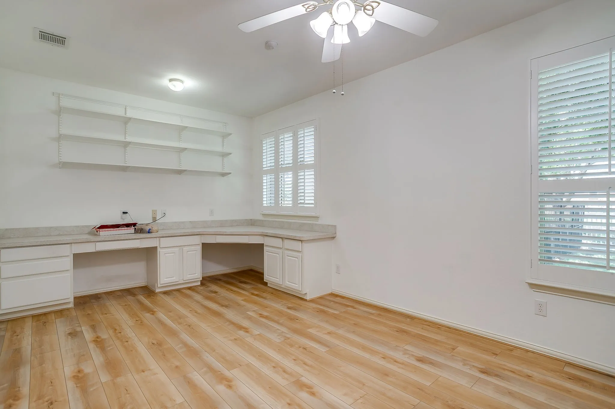 4th bedroom has built-in desk and book shelf