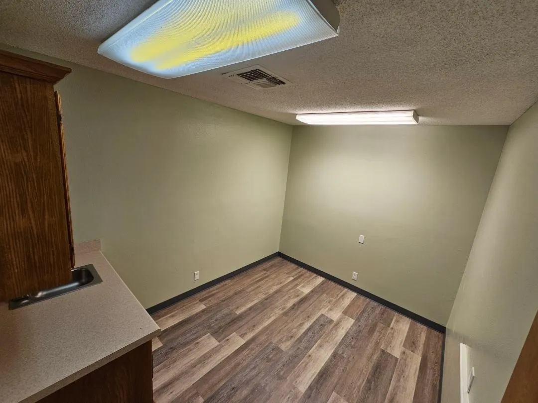 Exam Room #3 with cabinets and sink.