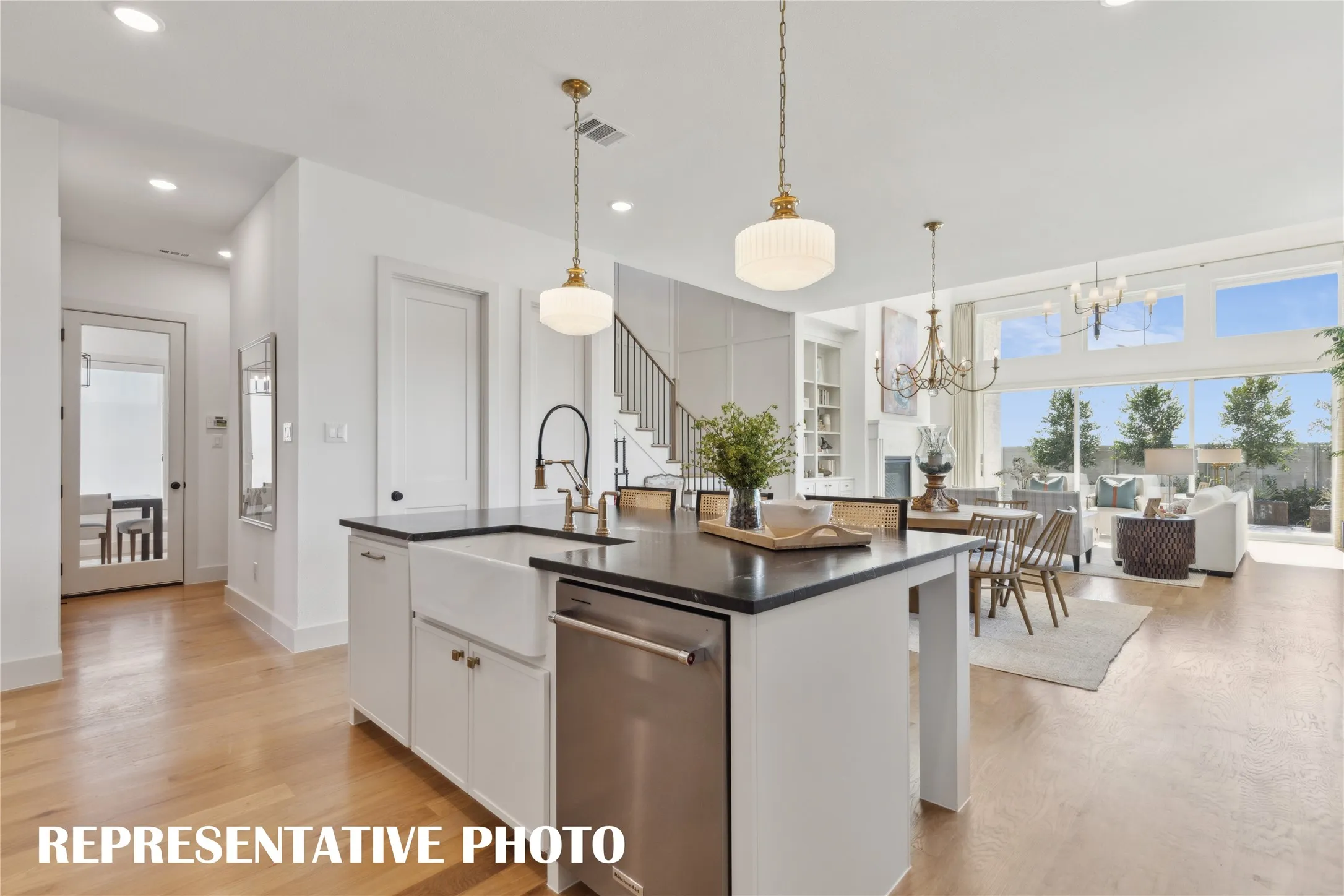 With a wonderfully designed open concept layout, the chef will never be left out of the party in this dream home!  REPRESENTATIVE PHOTO
