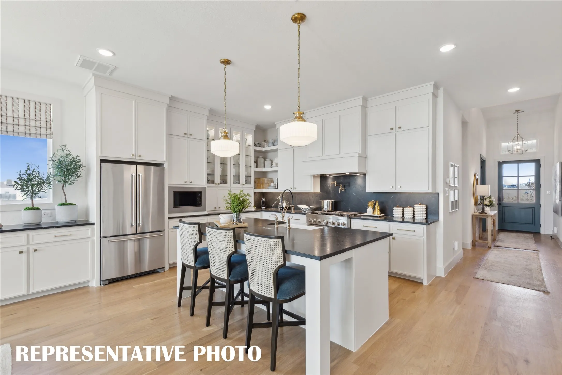 Featuring wonderful prep and storage spaces, this dream kitchen will inspire your inner chef!  REPRESENTATIVE PHOTO