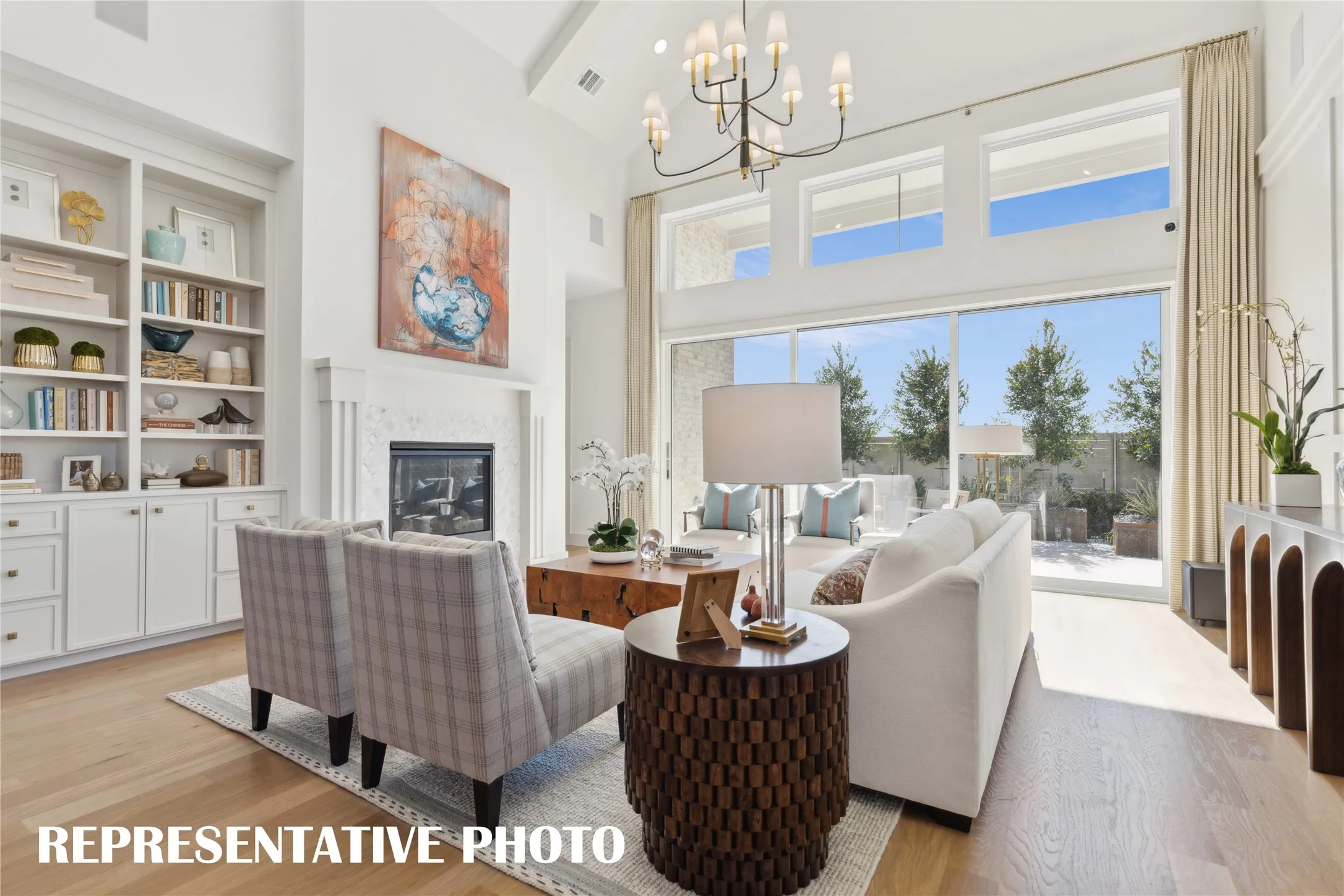 The full wall slider in this dream family room easily brings the outdoors in!  REPRESENTATIVE PHOTO