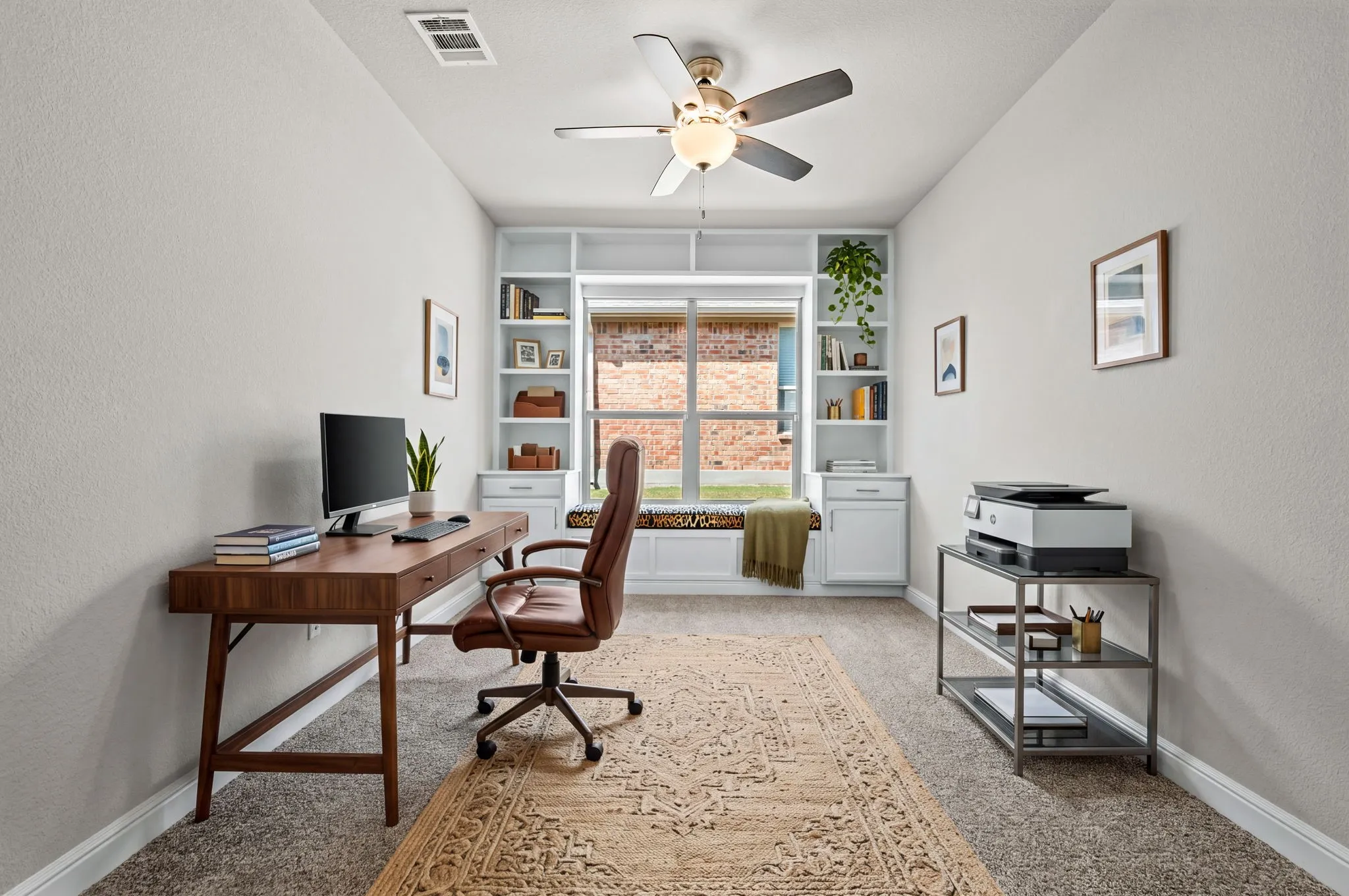 Recessed window with built-in cabinetry and shelving