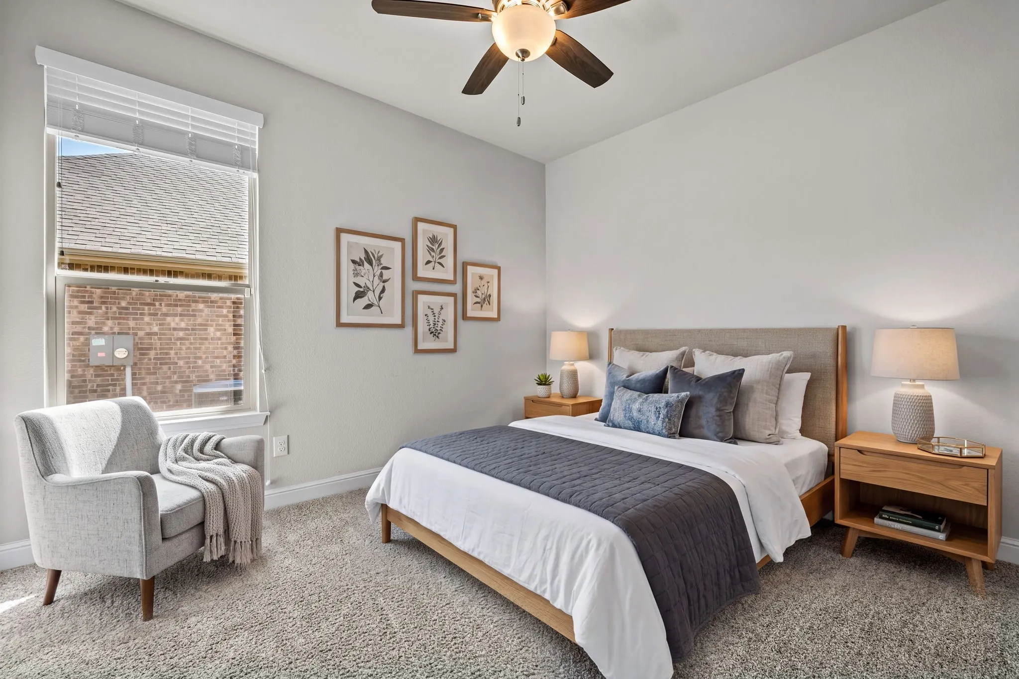 Neutral wall palette, carpet flooring, window with blinds, and a ceiling fan with integrated lighting