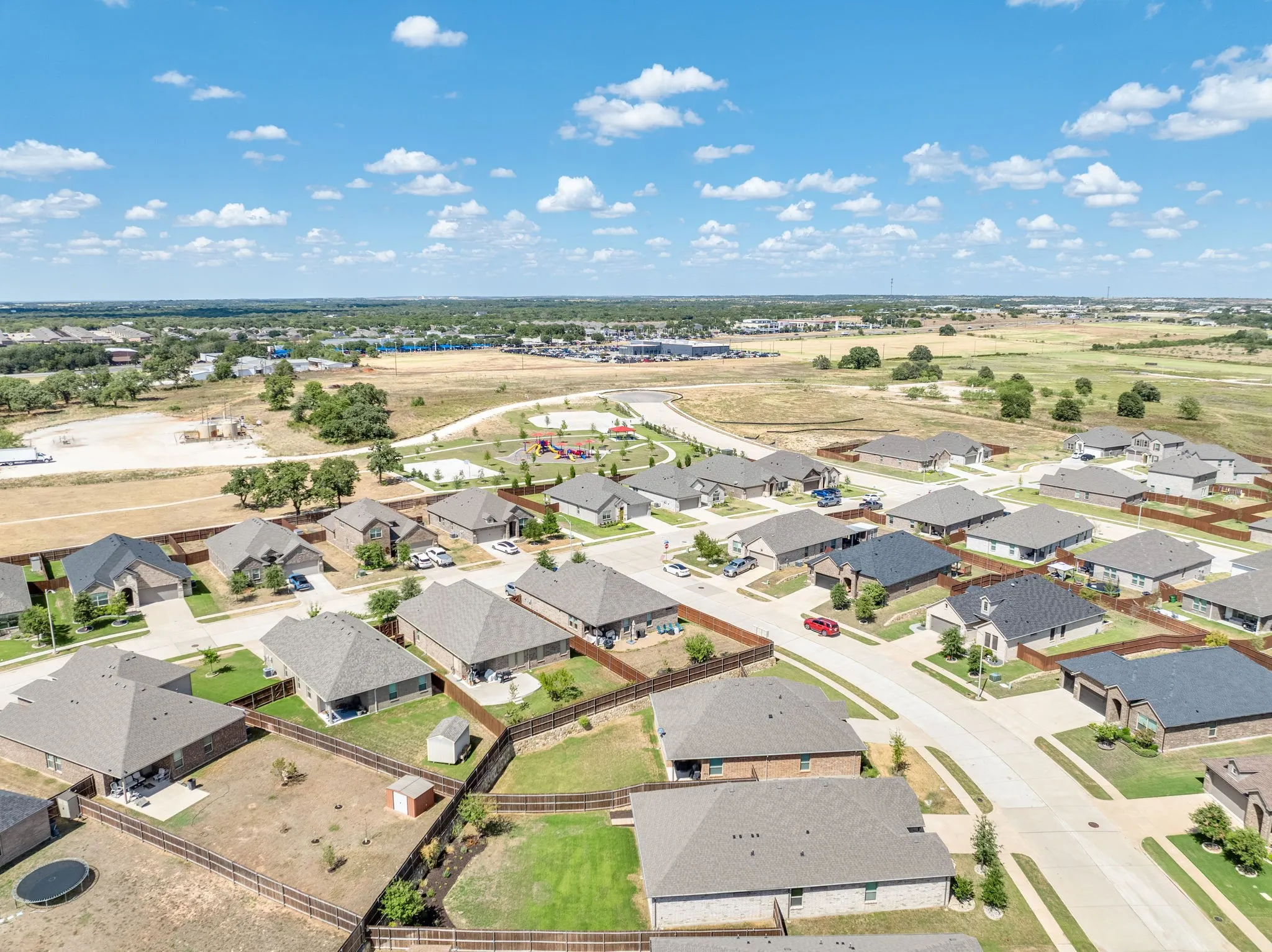 Residential neighborhood with diverse home exteriors and private fenced yards