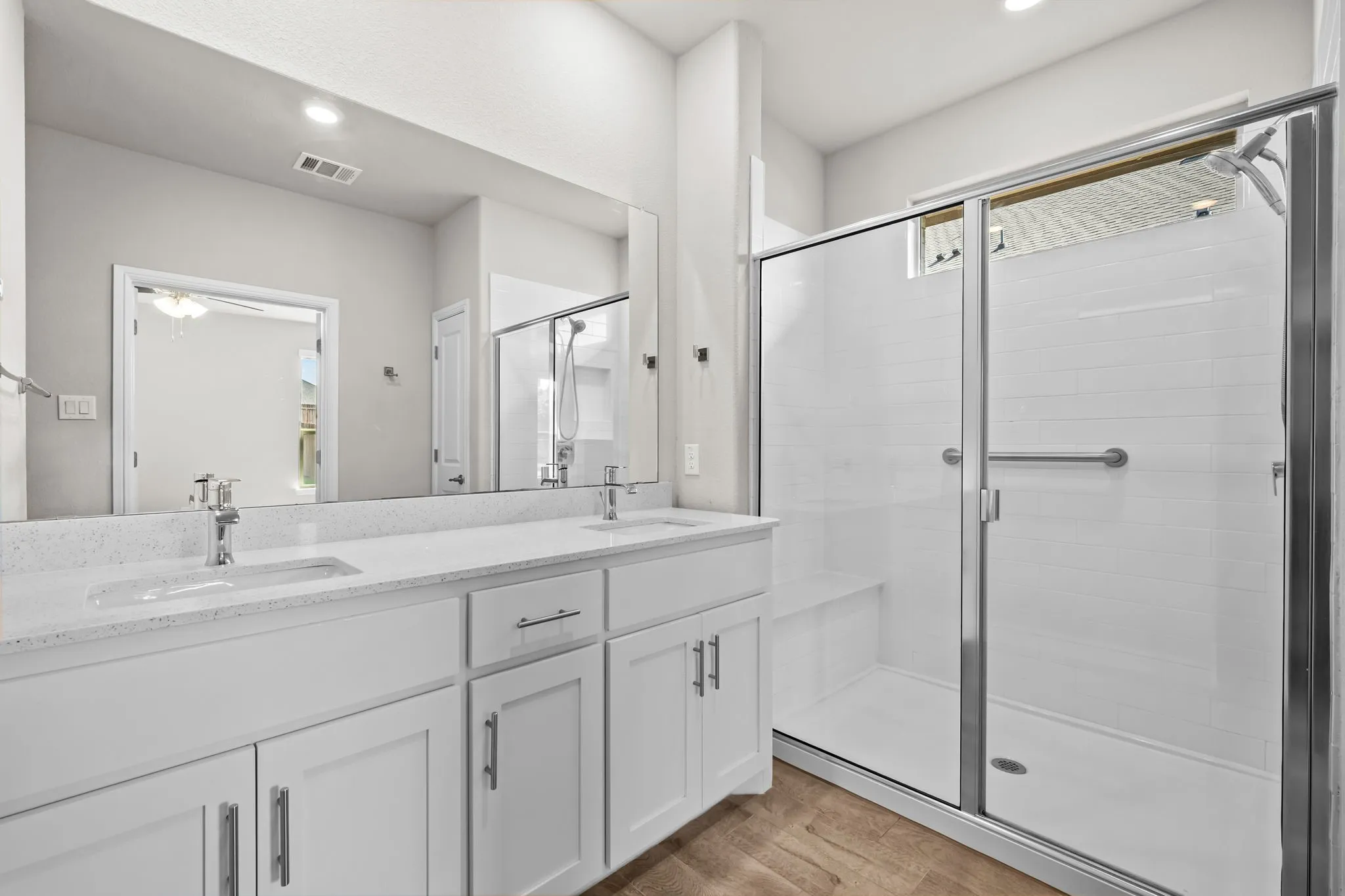Dual vanity with undermount sinks and stone-finish countertop