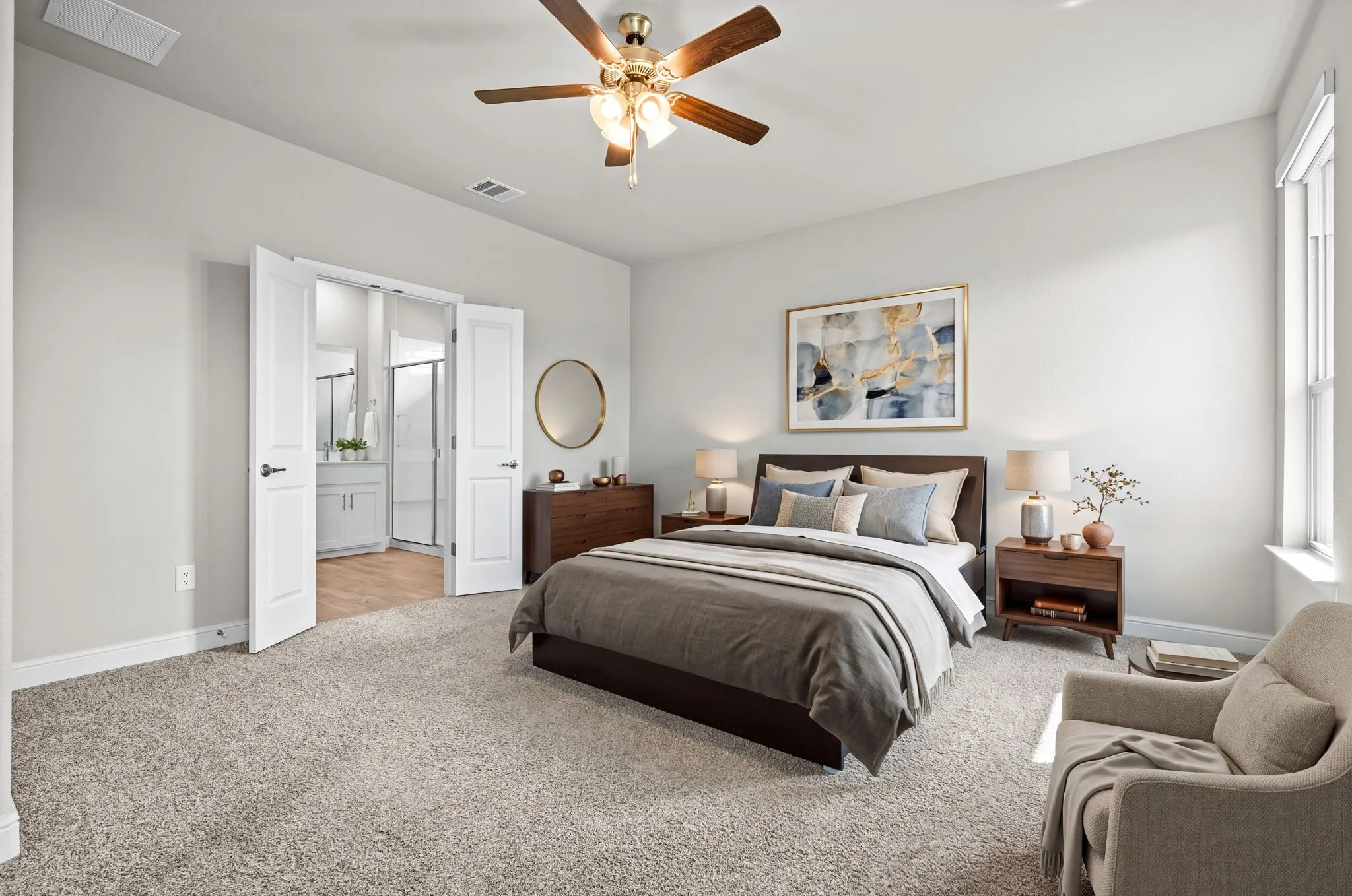 Ceiling fan with light fixture, light gray wall paint, light-colored carpeting, French doors, and a window with natural light