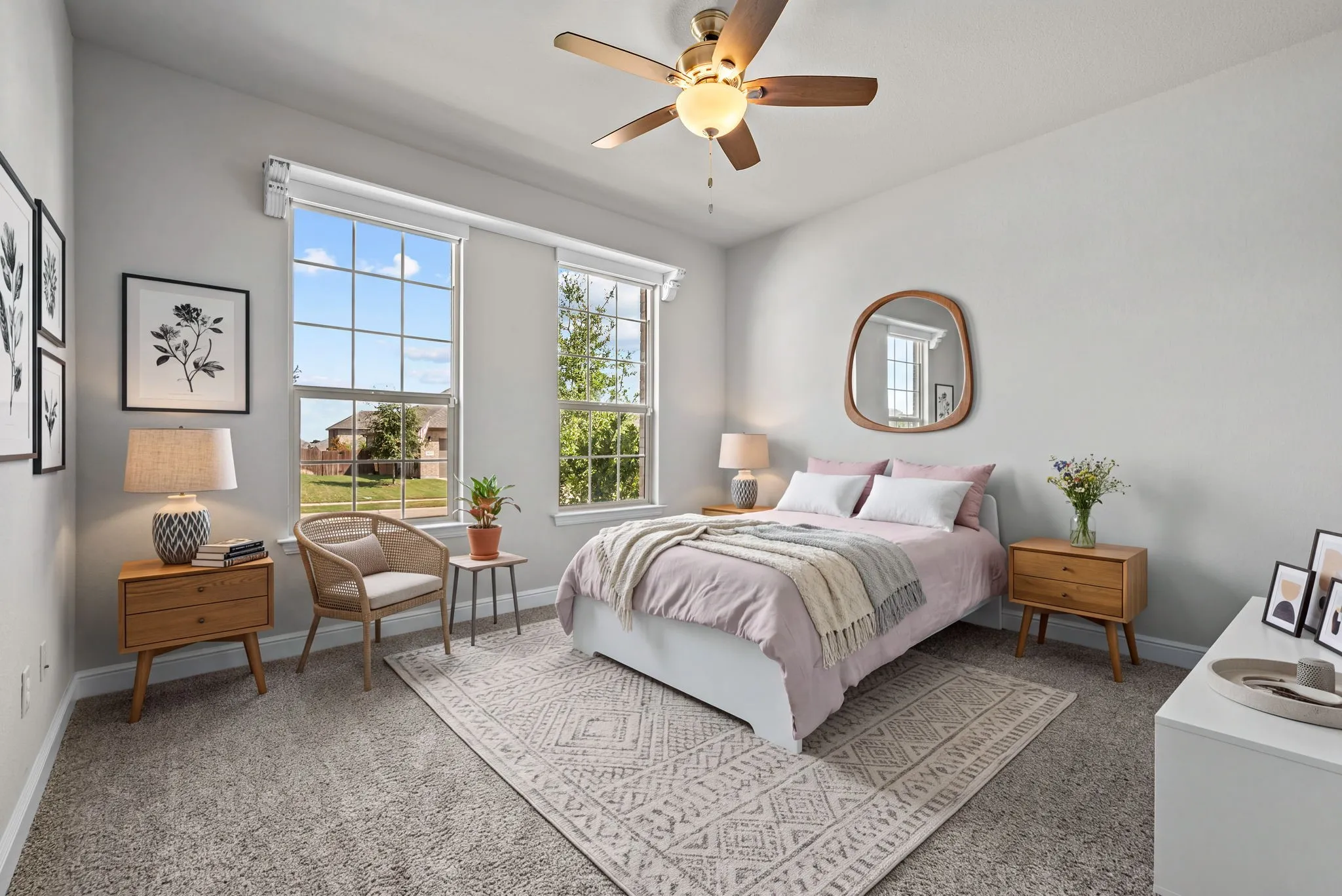 Dual pane windows with grid detailing, ceiling fan with integrated lighting, and neutral wall tones
